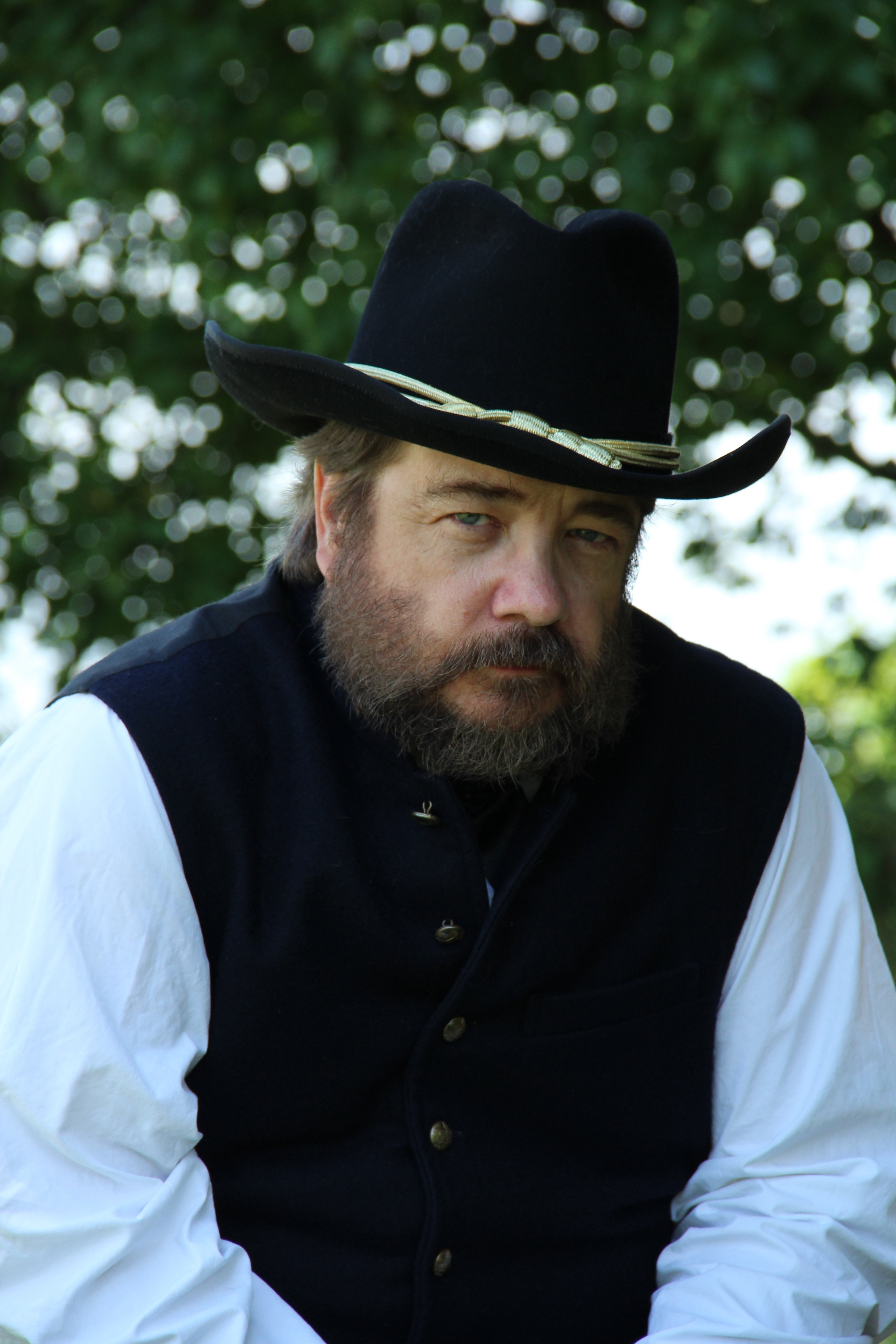 Headshot of Derek Maxfield dressed in a Civil War General's uniform and hat.